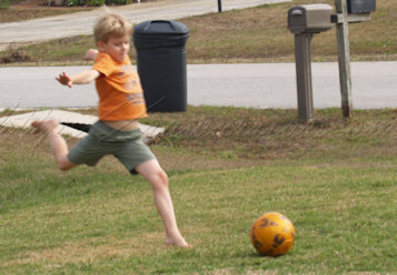 Roo kicking soccer ball