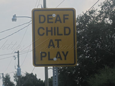 Deaf child at play sign