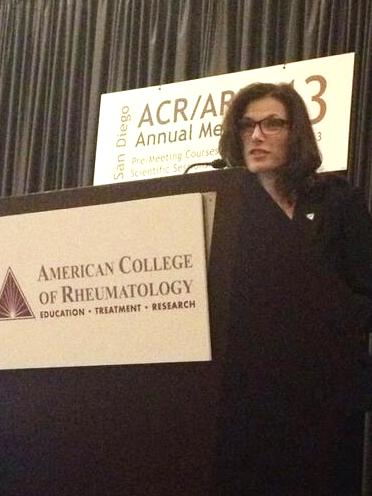 Kelly Young at podium at ACR13 speaking on Engaging Patients as Partners